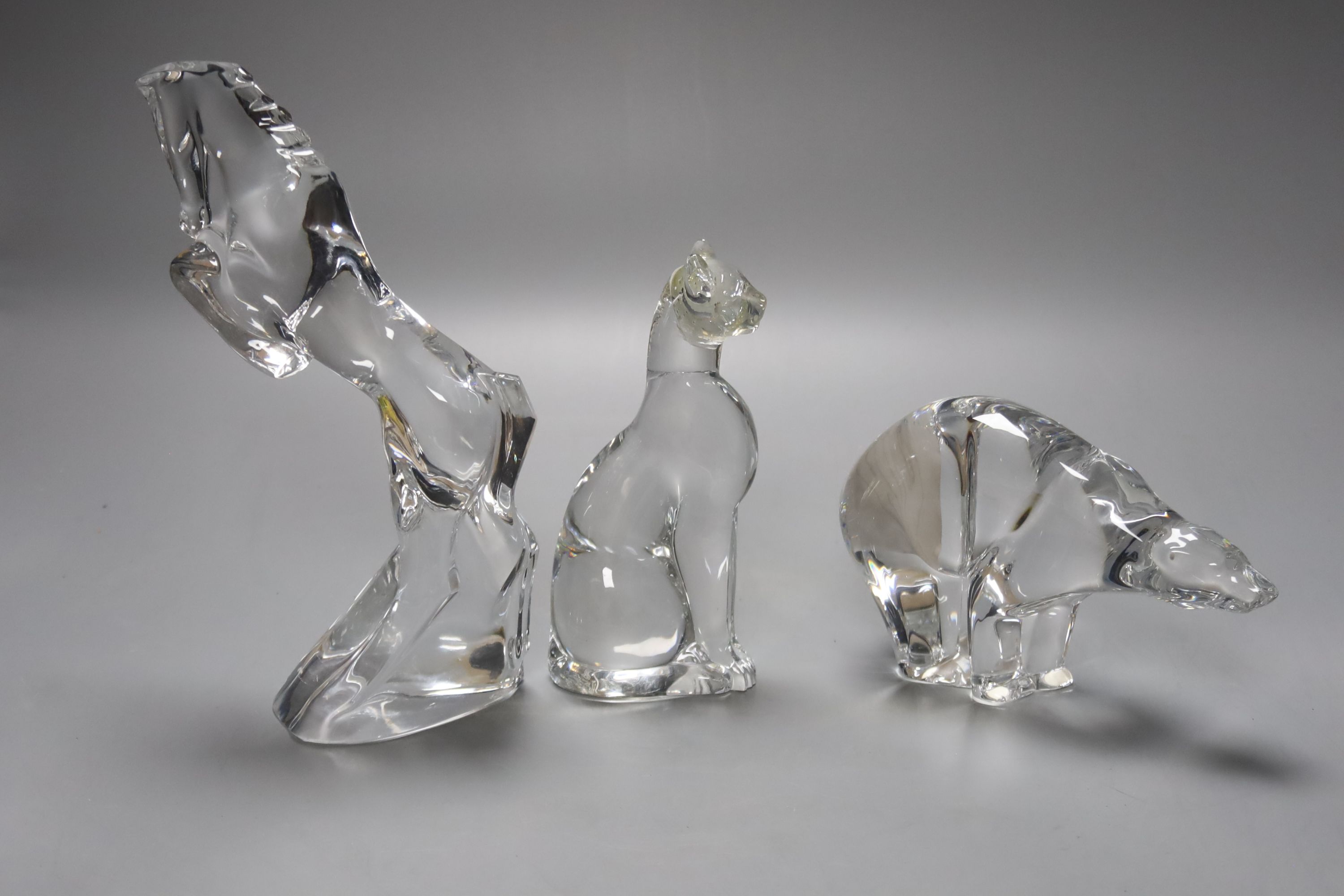 Three Baccarat crystal figures, a polar bear, 10cm high, a cheetah, 16cm high and a horse,22cm high